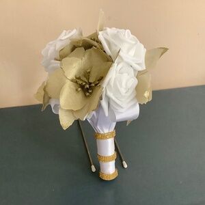 Gold poinsettia and rose wedding bouquet